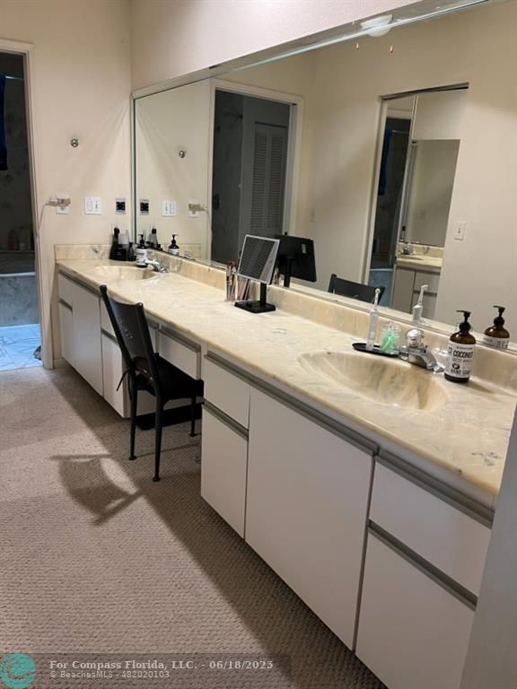 7876 La Mirada Drive Boca Raton, FL 33433 - Photo 12 of 34 a bathroom with a sink and a mirror