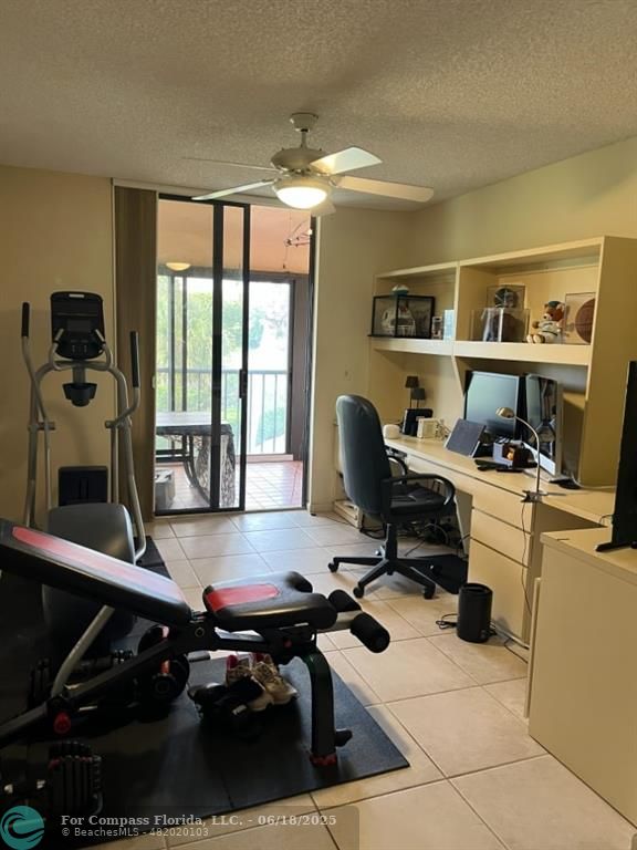 7876 La Mirada Drive Boca Raton, FL 33433 - Photo 15 of 34 a view of a workspace with furniture and a window
