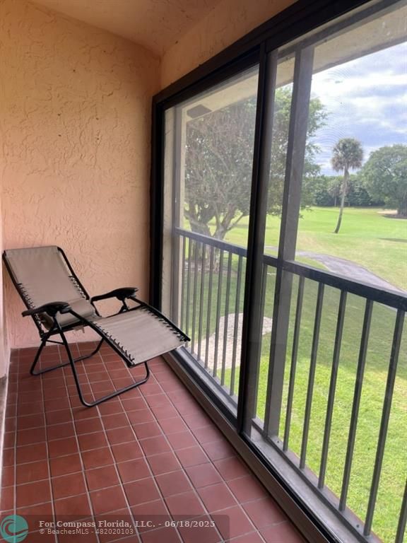 7876 La Mirada Drive Boca Raton, FL 33433 - Photo 18 of 34 a view of a balcony with chairs