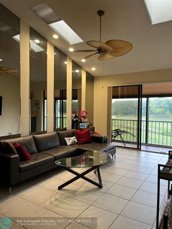7876 La Mirada Drive Boca Raton, FL 33433 - Photo 6 of 34 a living room with furniture and a large window