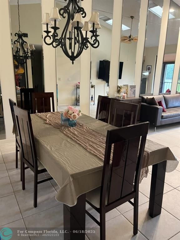 7876 La Mirada Drive Boca Raton, FL 33433 - Photo 7 of 34 a view of a dining room with furniture and wooden floor