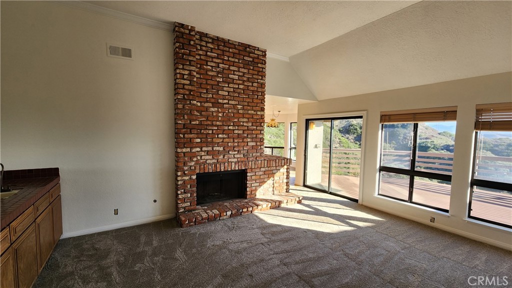 750 Avenida Acapulco San Clemente, CA 92672 - Photo 14 of 25 a view of an empty room with a fireplace