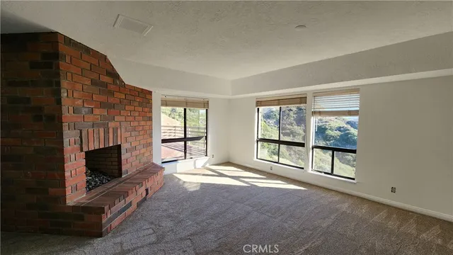 a view of a livingroom with wooden floor