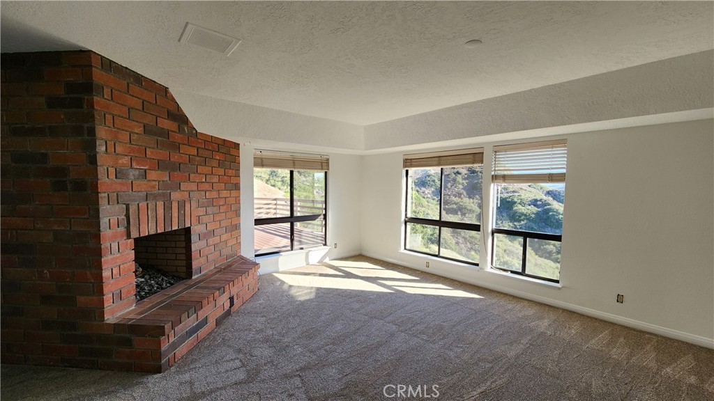 750 Avenida Acapulco San Clemente, CA 92672 - Photo 19 of 25 a view of an empty room with fireplace and a window