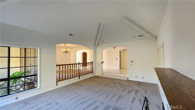 a kitchen with wooden cabinets and a wooden floor