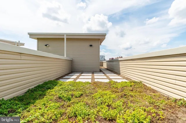a view of a backyard with sitting area