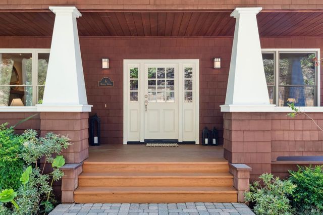 a view of a dining room with furniture wooden floor and chandelier