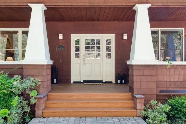a view of a dining room with furniture wooden floor and chandelier