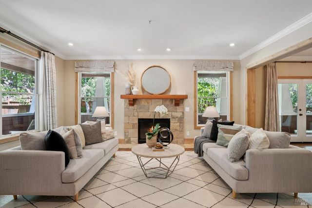 a living room with furniture and a window