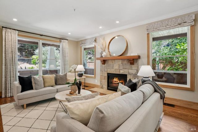 a living room with furniture and a fireplace