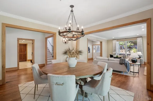 a view of an entryway with wooden floor and stairs