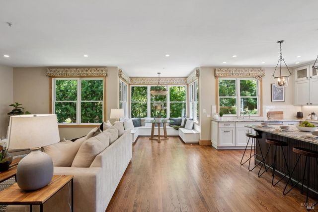 a view of a living room and a balcony