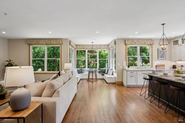 a view of a living room and a balcony