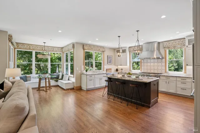 a bedroom with bed and a painting on the wall