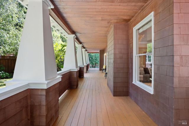 a living room with furniture a window and a fireplace