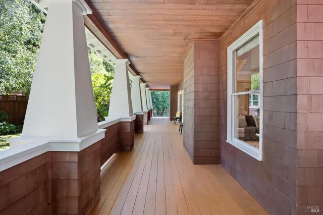 a living room with furniture a window and a fireplace