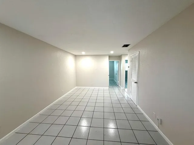 a view of an empty room and window