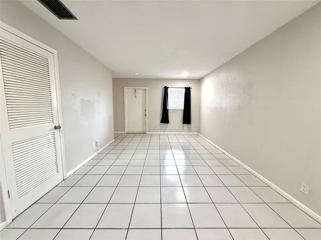 a view of an empty room and window