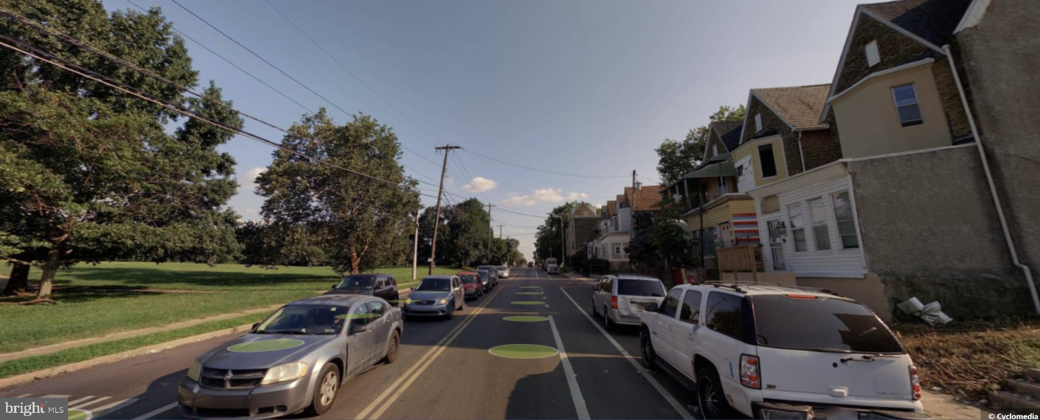 4426 Old York Road Philadelphia, PA 19140 - Photo 6 of 7 Charming street lined with lush greenery.