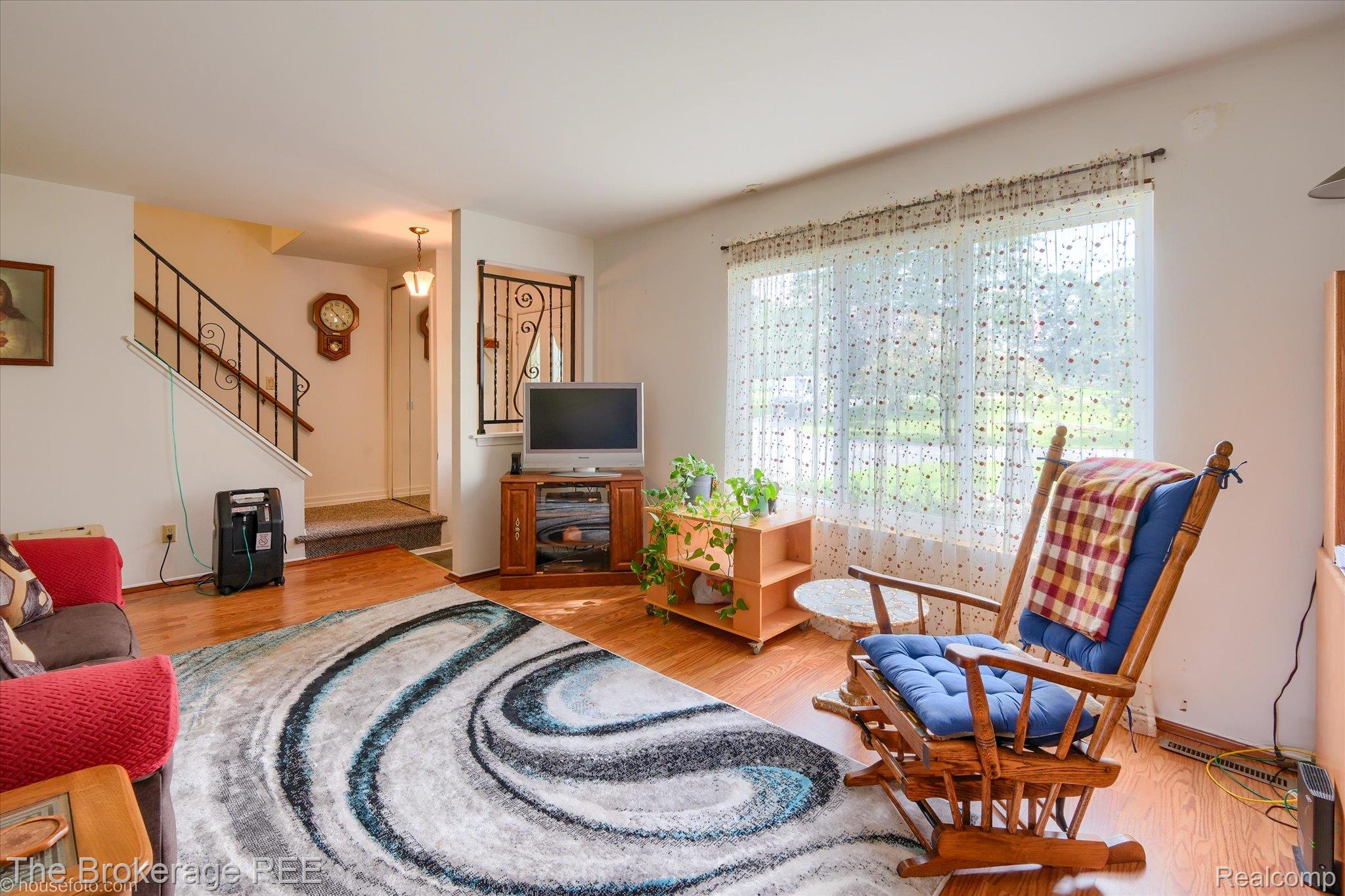 6129 East Lake Road Millington, MI 48746 - Photo 7 of 47 Living area featuring light wood-style floors and stairs