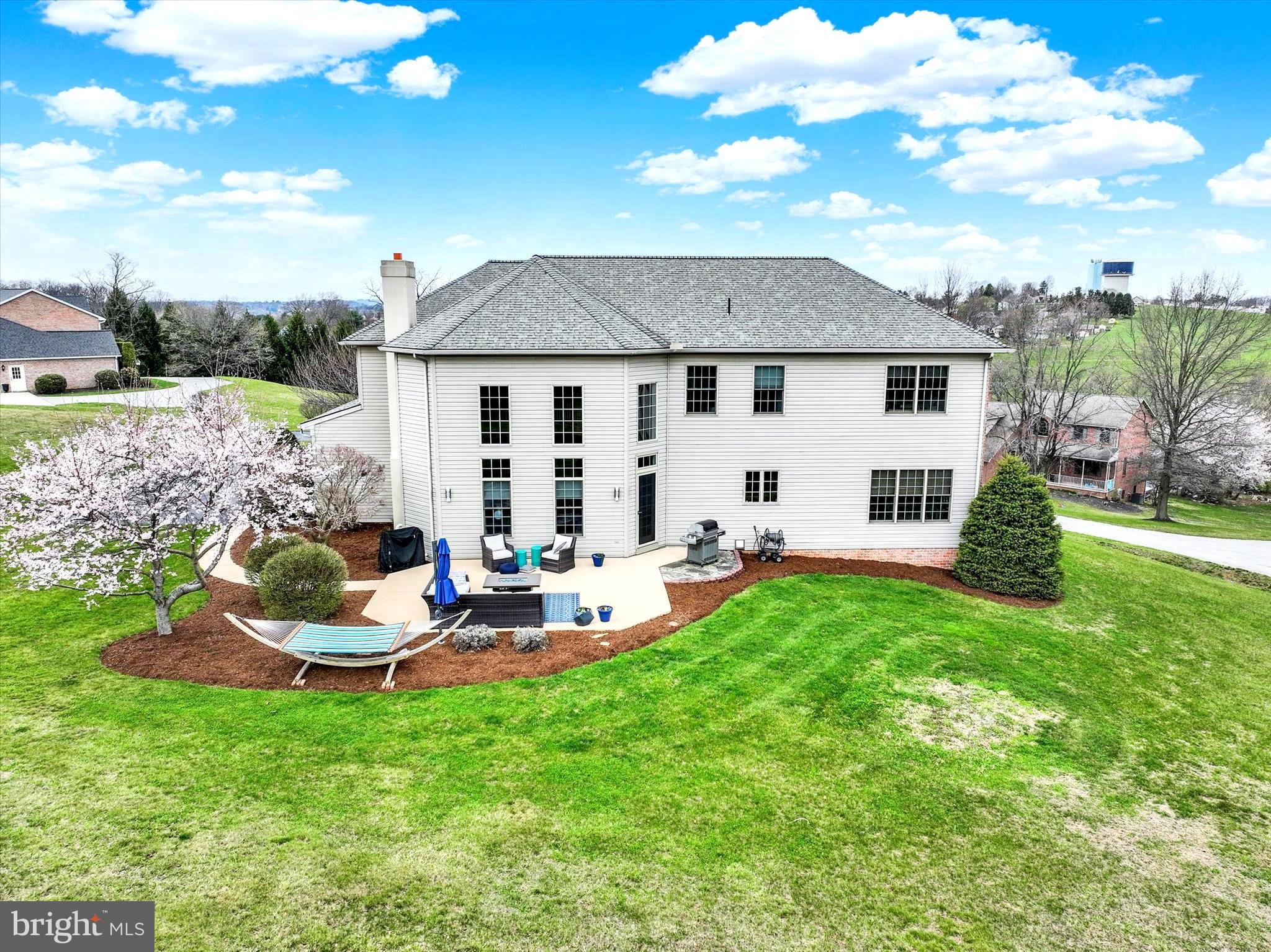 750 Rydell Drive Dallastown, PA 17313 - Photo 11 of 61 a view of a house with backyard sitting area and garden