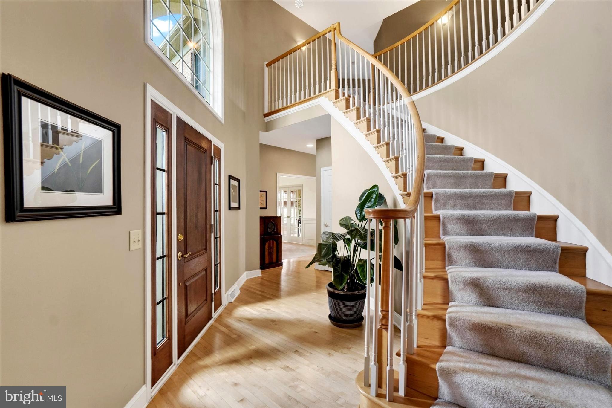 750 Rydell Drive Dallastown, PA 17313 - Photo 21 of 61 a view of staircase with lots of frames on wall and a chandelier