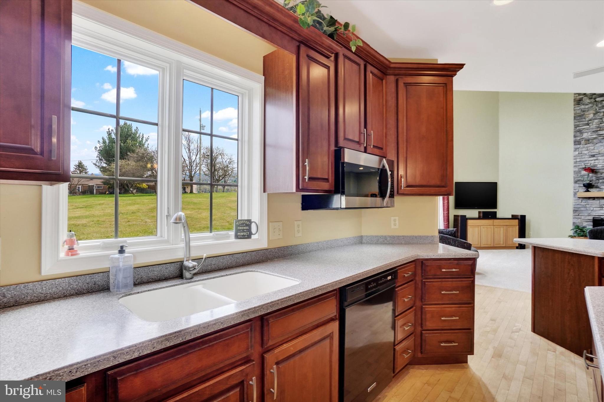 750 Rydell Drive Dallastown, PA 17313 - Photo 29 of 61 a kitchen with stainless steel appliances granite countertop a sink and a counter space