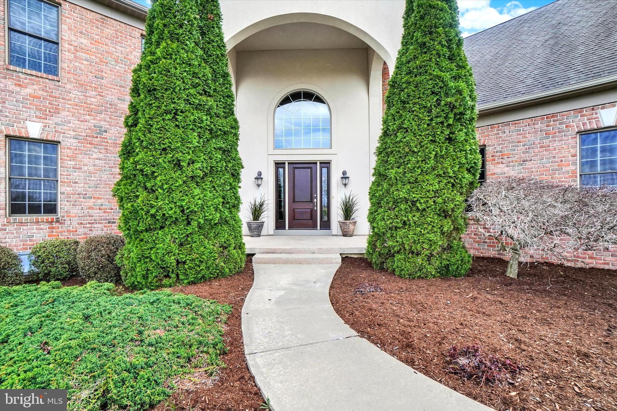 750 Rydell Drive Dallastown, PA 17313 - Photo 4 of 61 front view of a house with a garden
