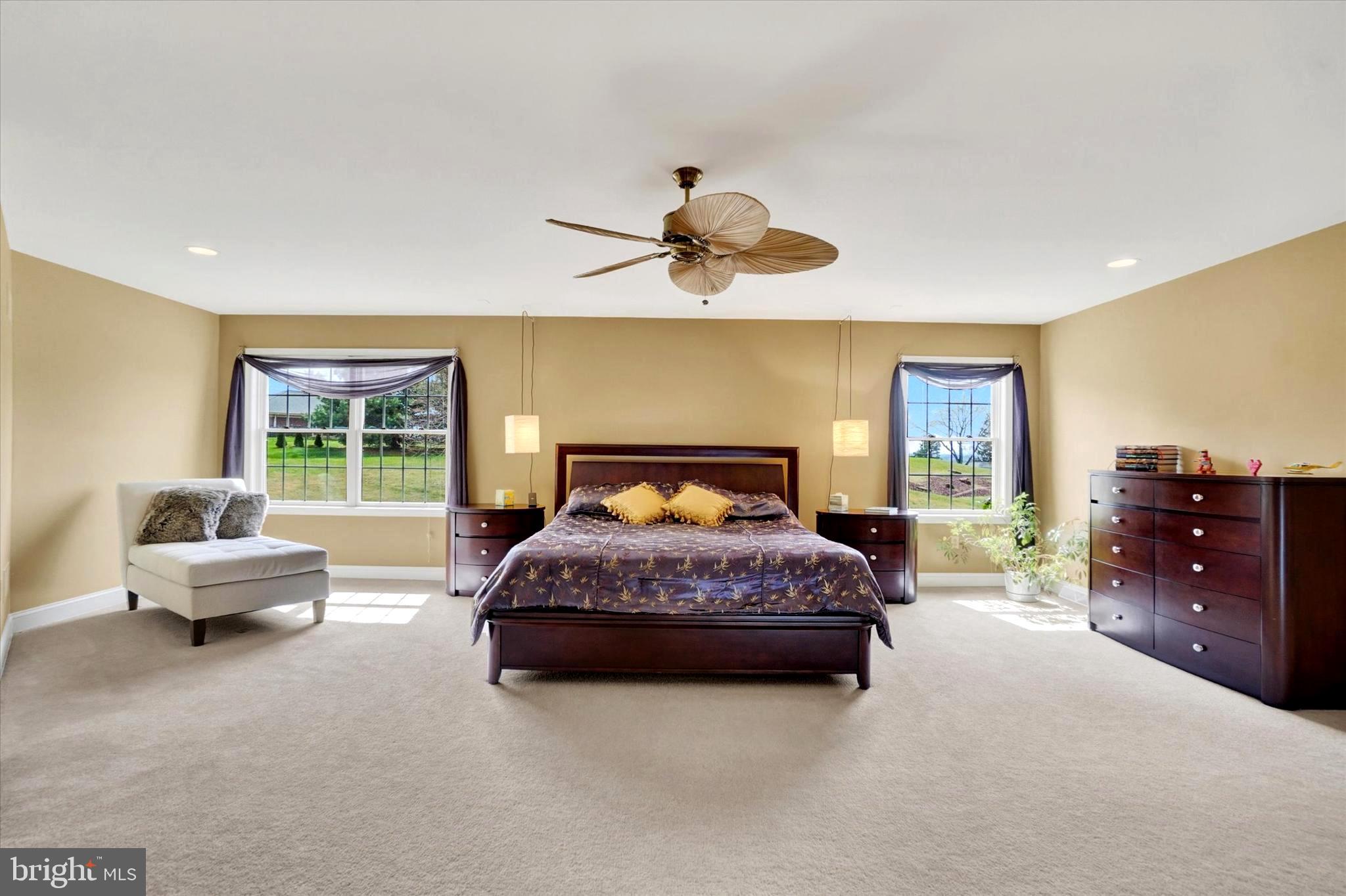 750 Rydell Drive Dallastown, PA 17313 - Photo 44 of 61 a spacious bedroom with a bed and a chandelier