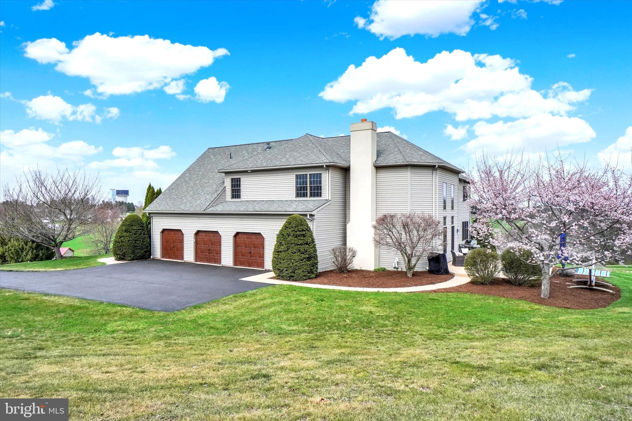 750 Rydell Drive Dallastown, PA 17313 - Photo 5 of 61 a front view of a house with garden