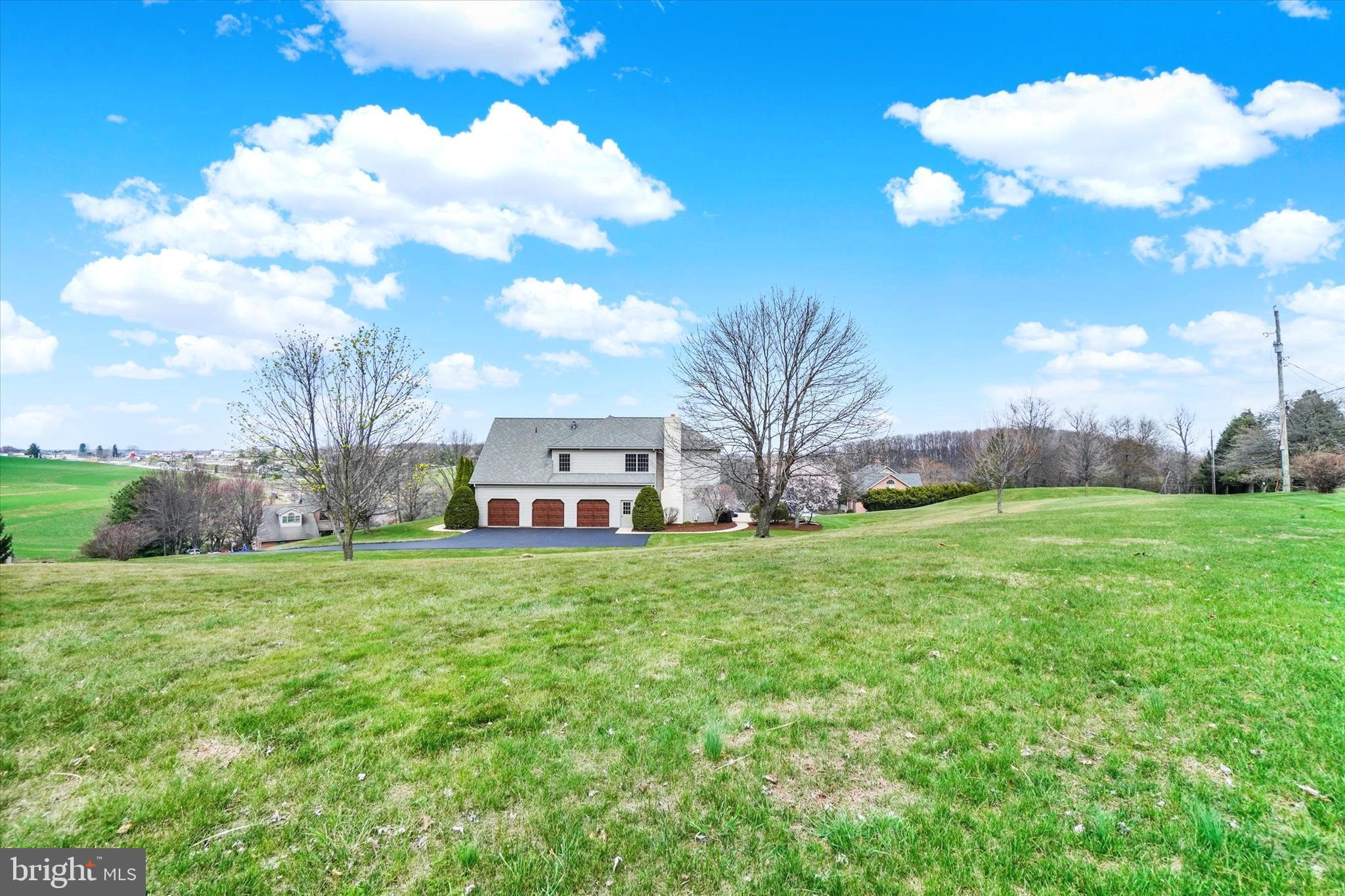 750 Rydell Drive Dallastown, PA 17313 - Photo 10 of 61 a front view of house with garden and trees