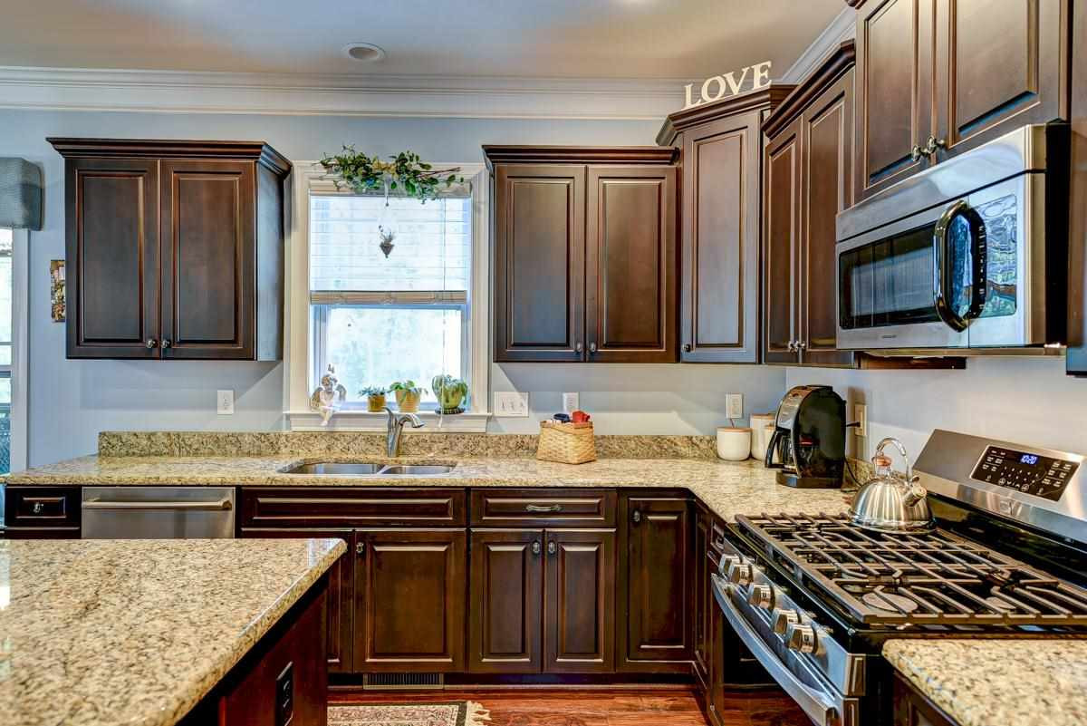 1212 Barnford Mill Road Wake Forest, NC 27587 - Photo 9 of 30 Stainless steel appliances.Stainless steel Gas range. Refrigerator conveys as is. Kitchen