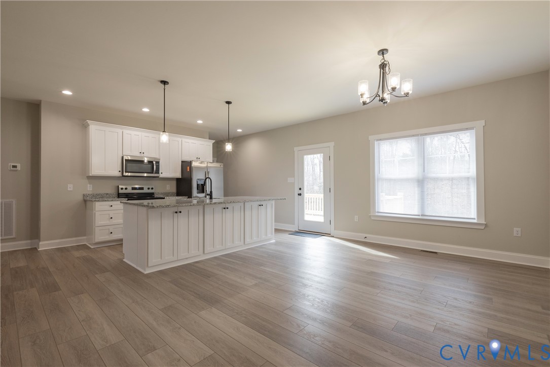 2223 Ridge Road Arvonia, VA 23004 - Photo 15 of 45 a view of kitchen with sink microwave and refrigerator