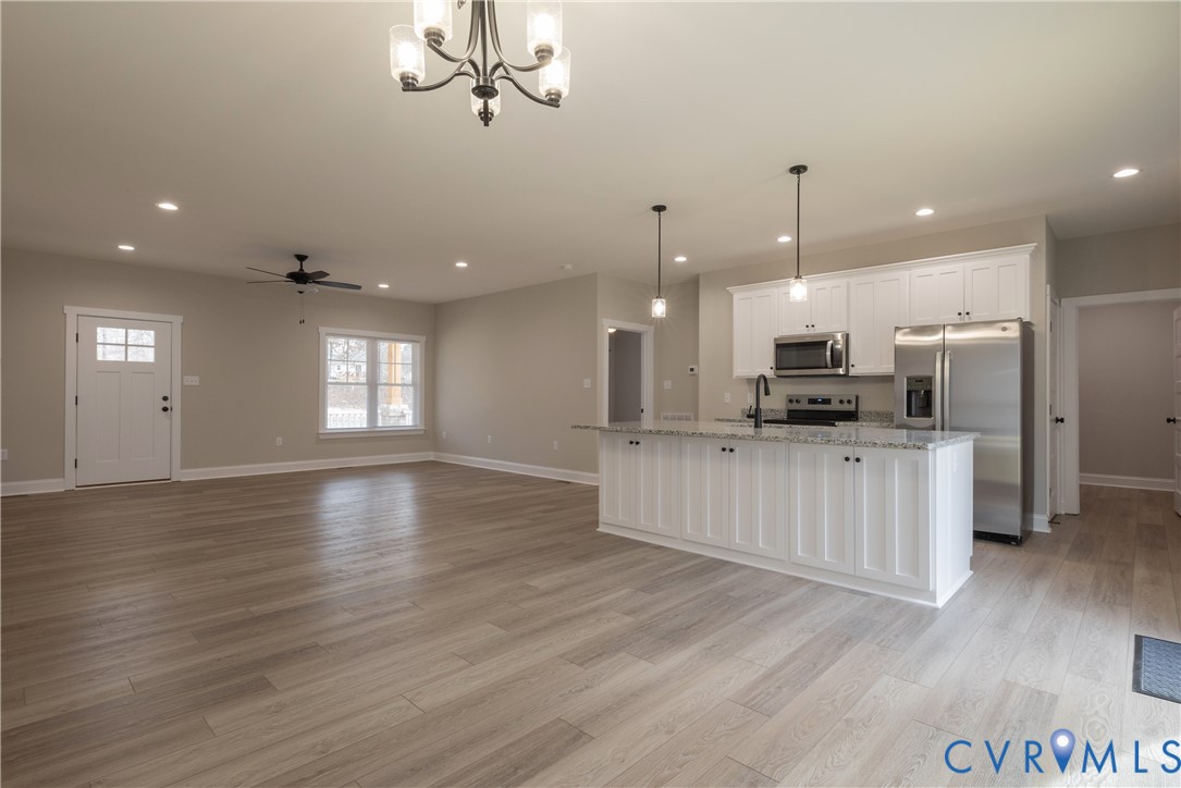 2223 Ridge Road Arvonia, VA 23004 - Photo 19 of 45 a view of kitchen with stainless steel appliances refrigerator oven and stove