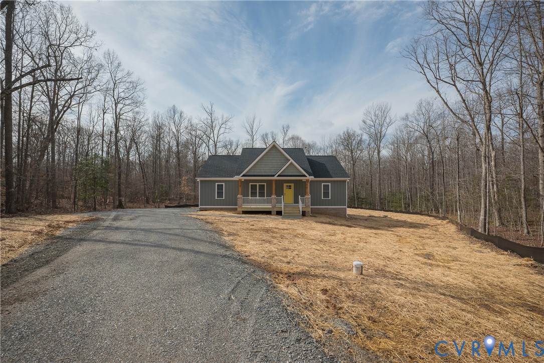 2223 Ridge Road Arvonia, VA 23004 - Photo 2 of 45 a house with trees in front of it