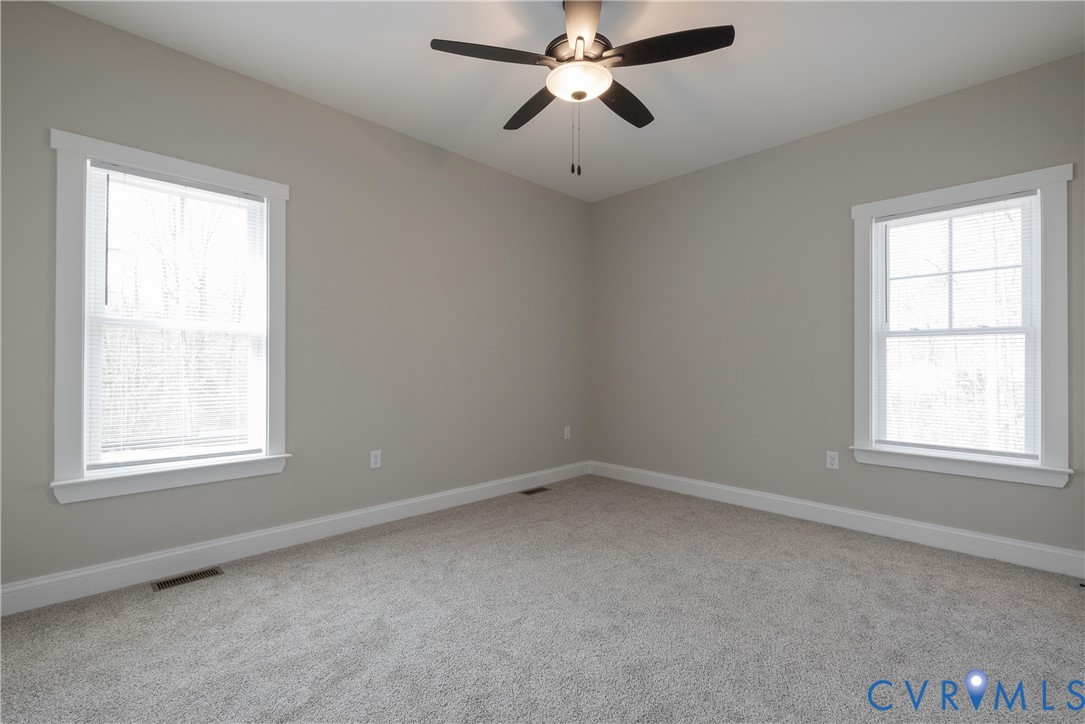2223 Ridge Road Arvonia, VA 23004 - Photo 33 of 45 an empty room with a window and a fan