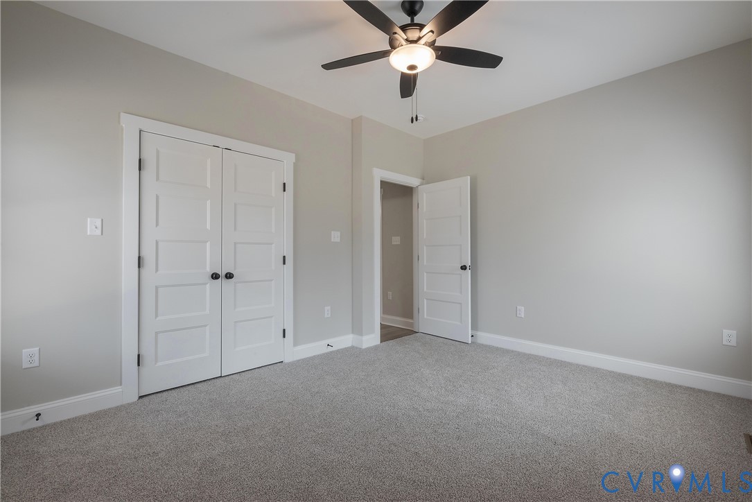 2223 Ridge Road Arvonia, VA 23004 - Photo 34 of 45 an empty room with chandelier fan