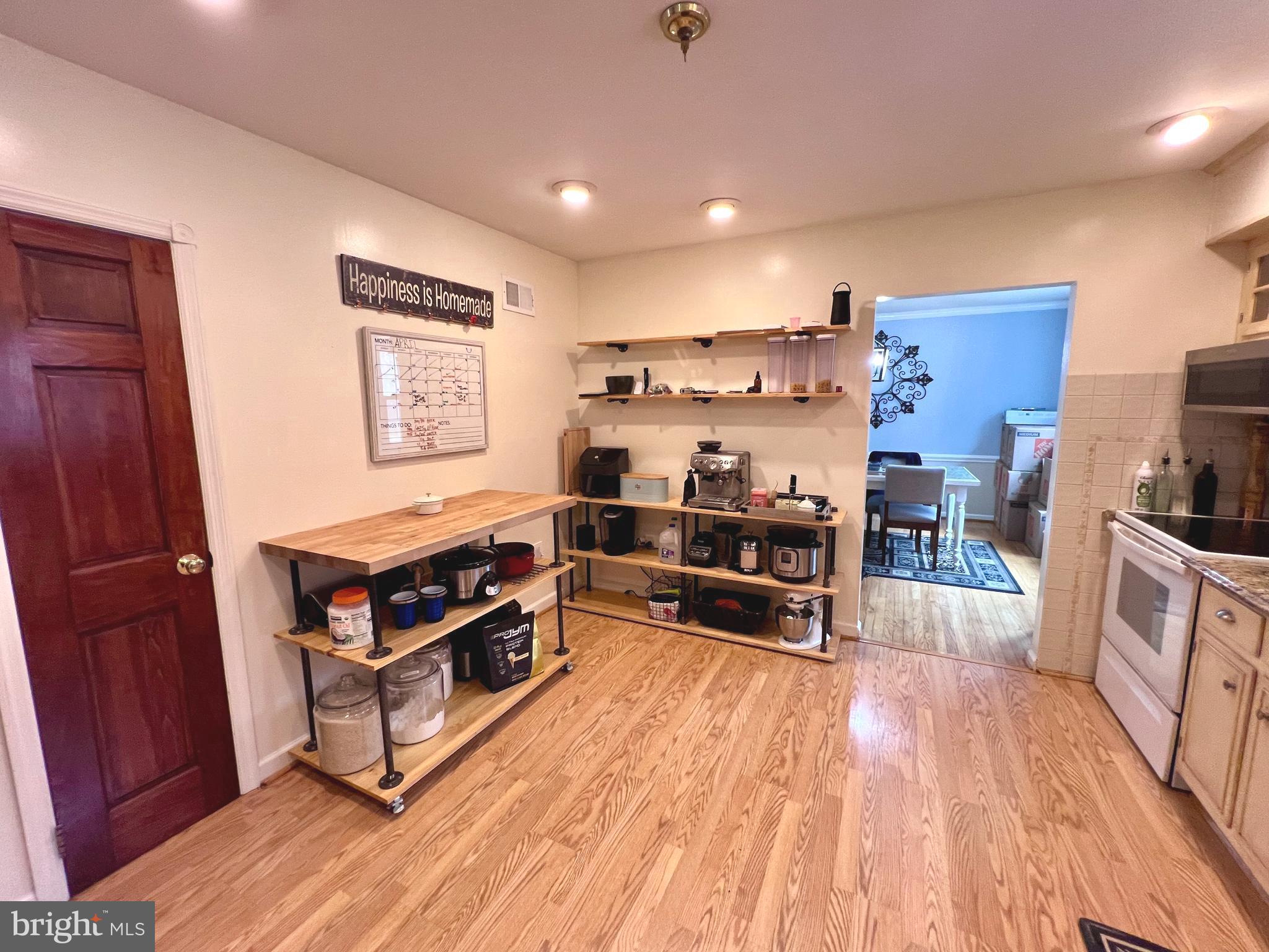 2418 Marilyn Drive Wilmington, DE 19810 - Photo 19 of 46 a room with wooden floors and white walls