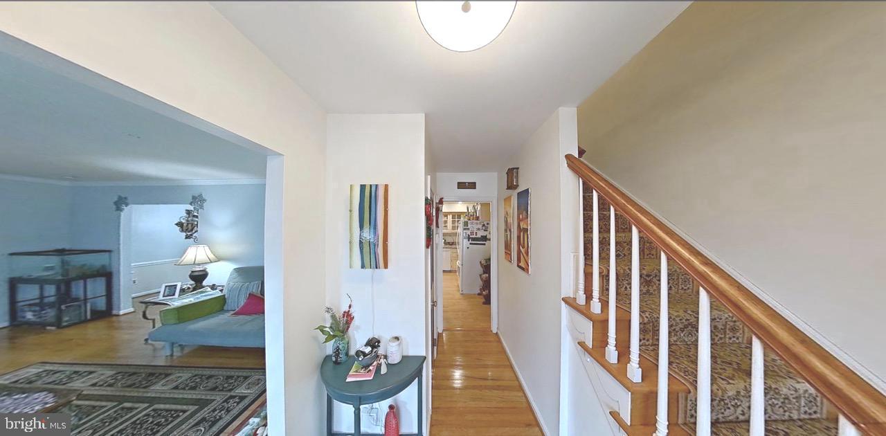 2418 Marilyn Drive Wilmington, DE 19810 - Photo 3 of 46 a view of a hallway with wooden floor and stairs