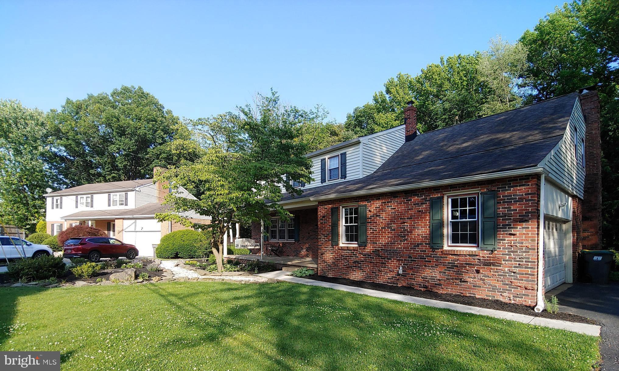 2418 Marilyn Drive Wilmington, DE 19810 - Photo 33 of 46 a front view of a house with a garden