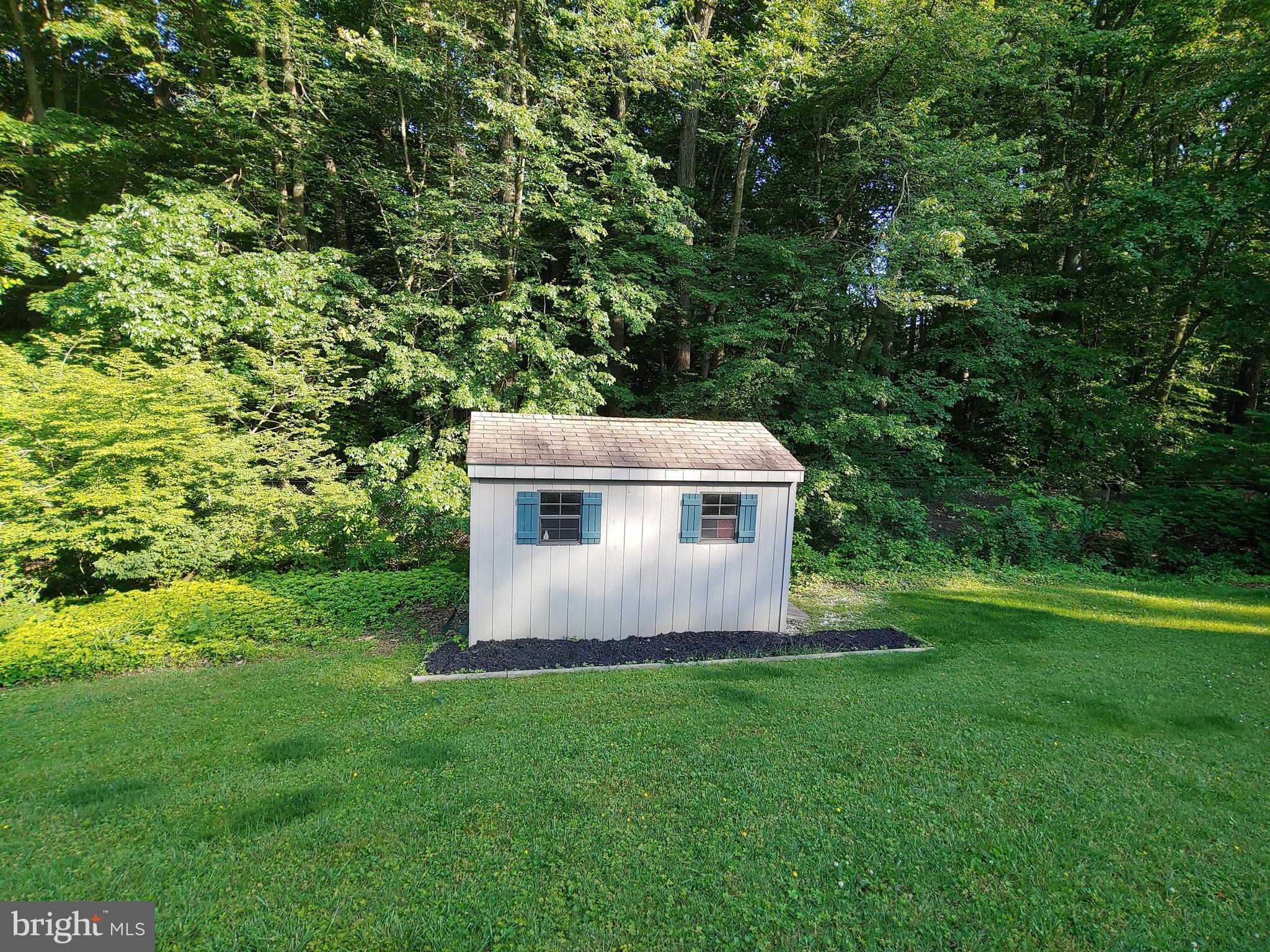 2418 Marilyn Drive Wilmington, DE 19810 - Photo 36 of 46 a view of a backyard with plants and a garden