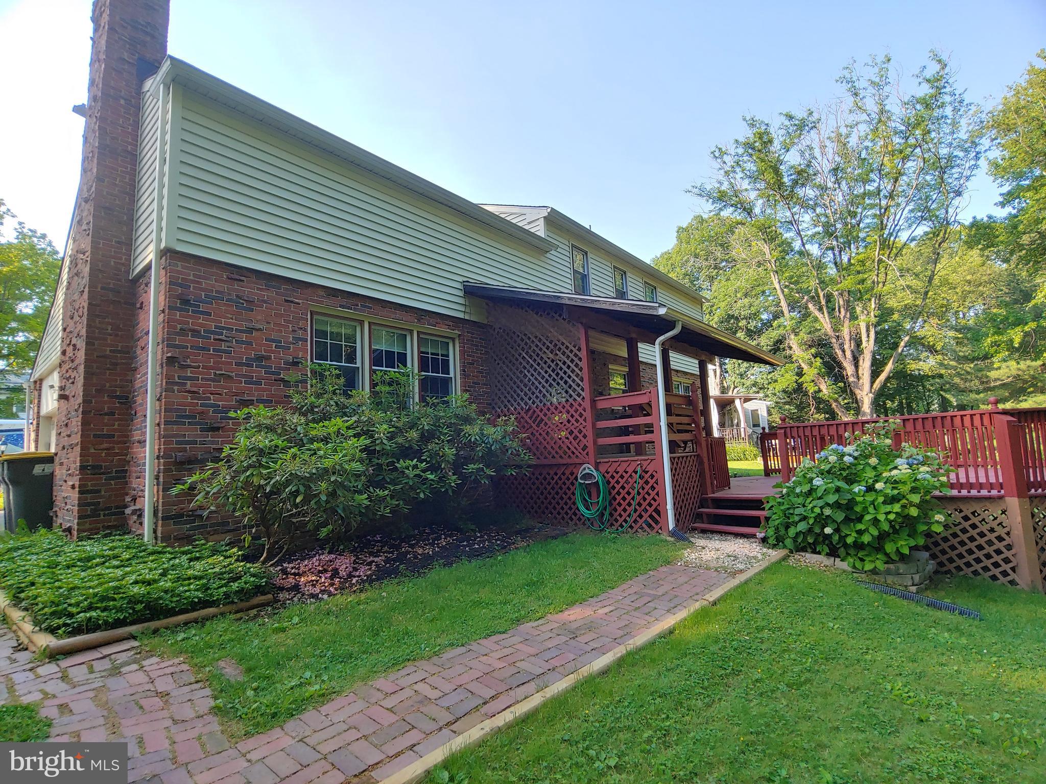 2418 Marilyn Drive Wilmington, DE 19810 - Photo 38 of 46 a front view of a house with a garden and plants
