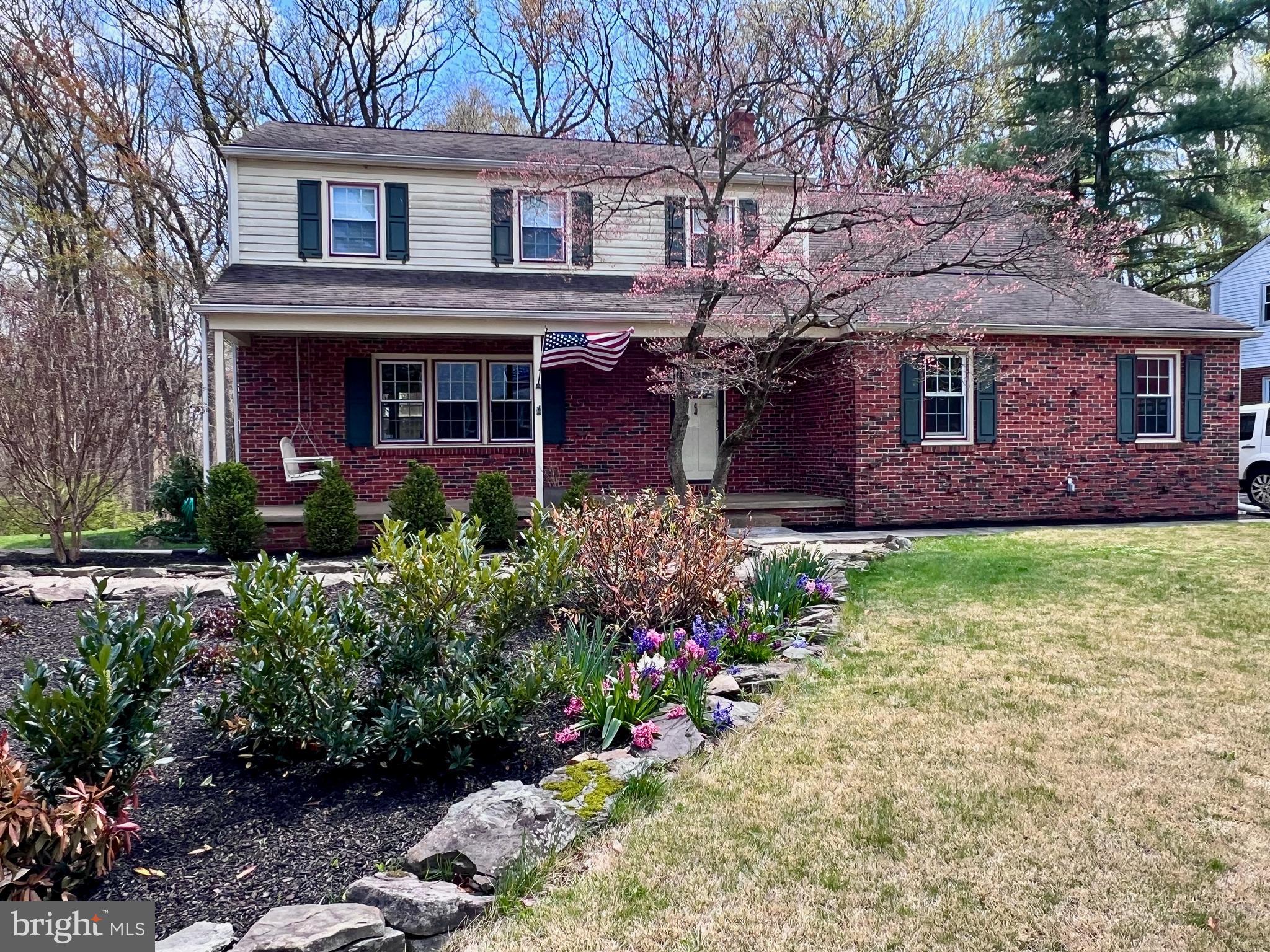 2418 Marilyn Drive Wilmington, DE 19810 - Photo 42 of 46 a front view of a house with a yard and a garden