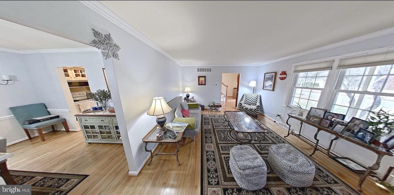 2418 Marilyn Drive Wilmington, DE 19810 - Photo 6 of 46 a living room with furniture and wooden floor