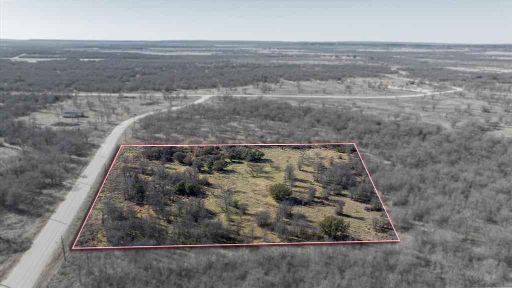 Lot 27 Paradise Oaks Ranch Perrin, TX 76486 - Photo 2 of 21 an aerial view of a dry yard
