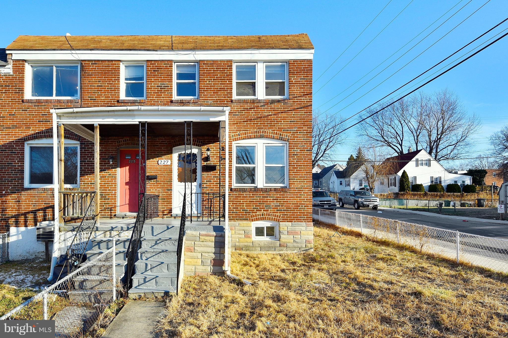 227 Old Riverside Road Baltimore, MD 21225 - Photo 2 of 20 a front view of a house with a yard