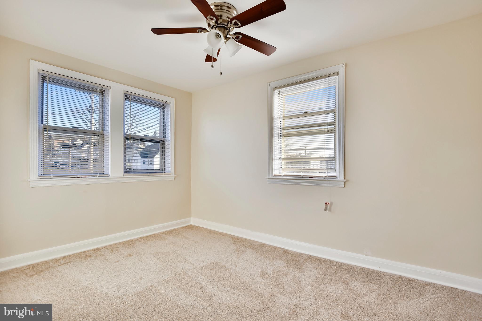 227 Old Riverside Road Baltimore, MD 21225 - Photo 15 of 20 an empty room with windows and fan