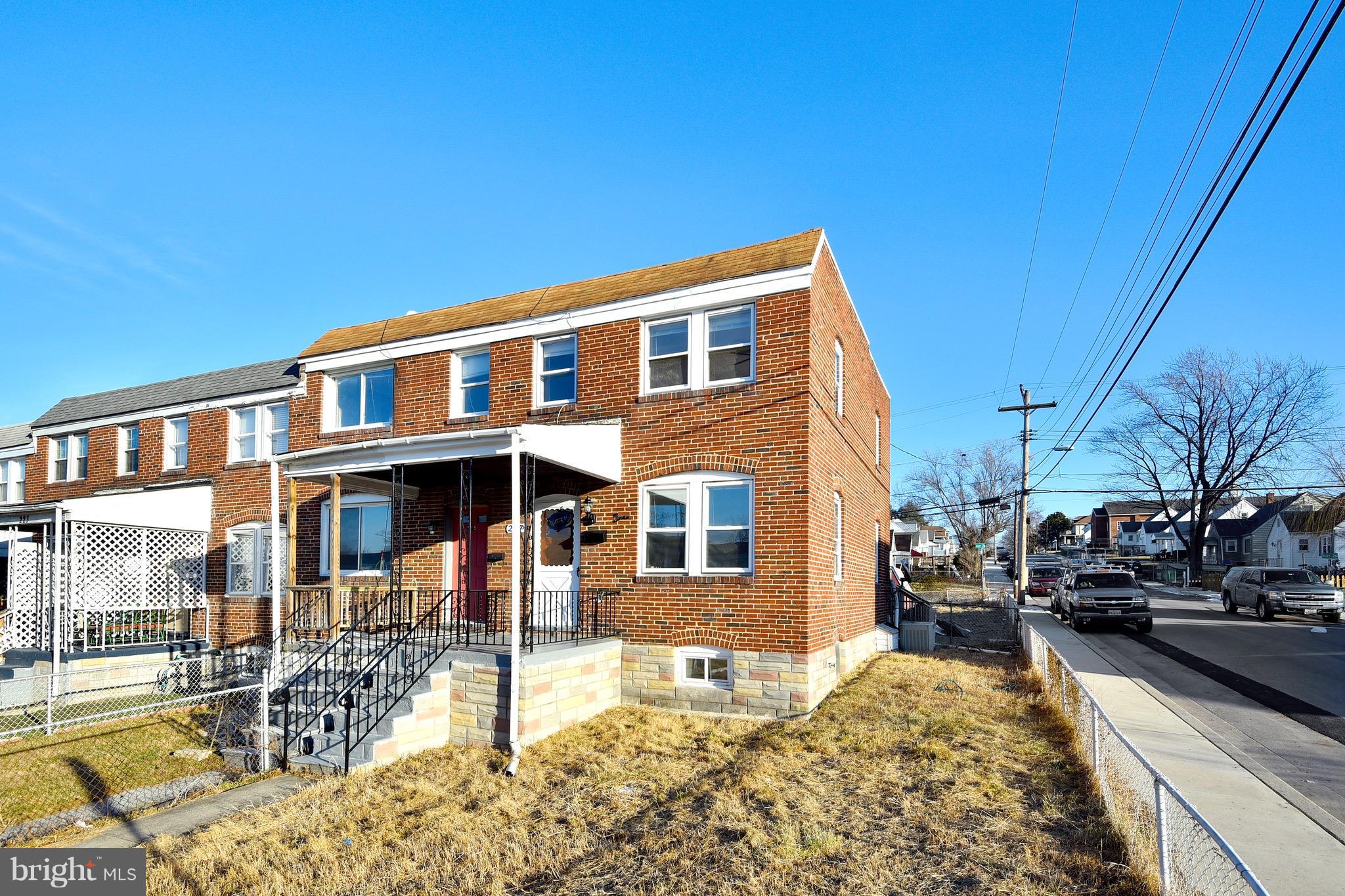 227 Old Riverside Road Baltimore, MD 21225 - Photo 4 of 20 a front view of a house with cars parked