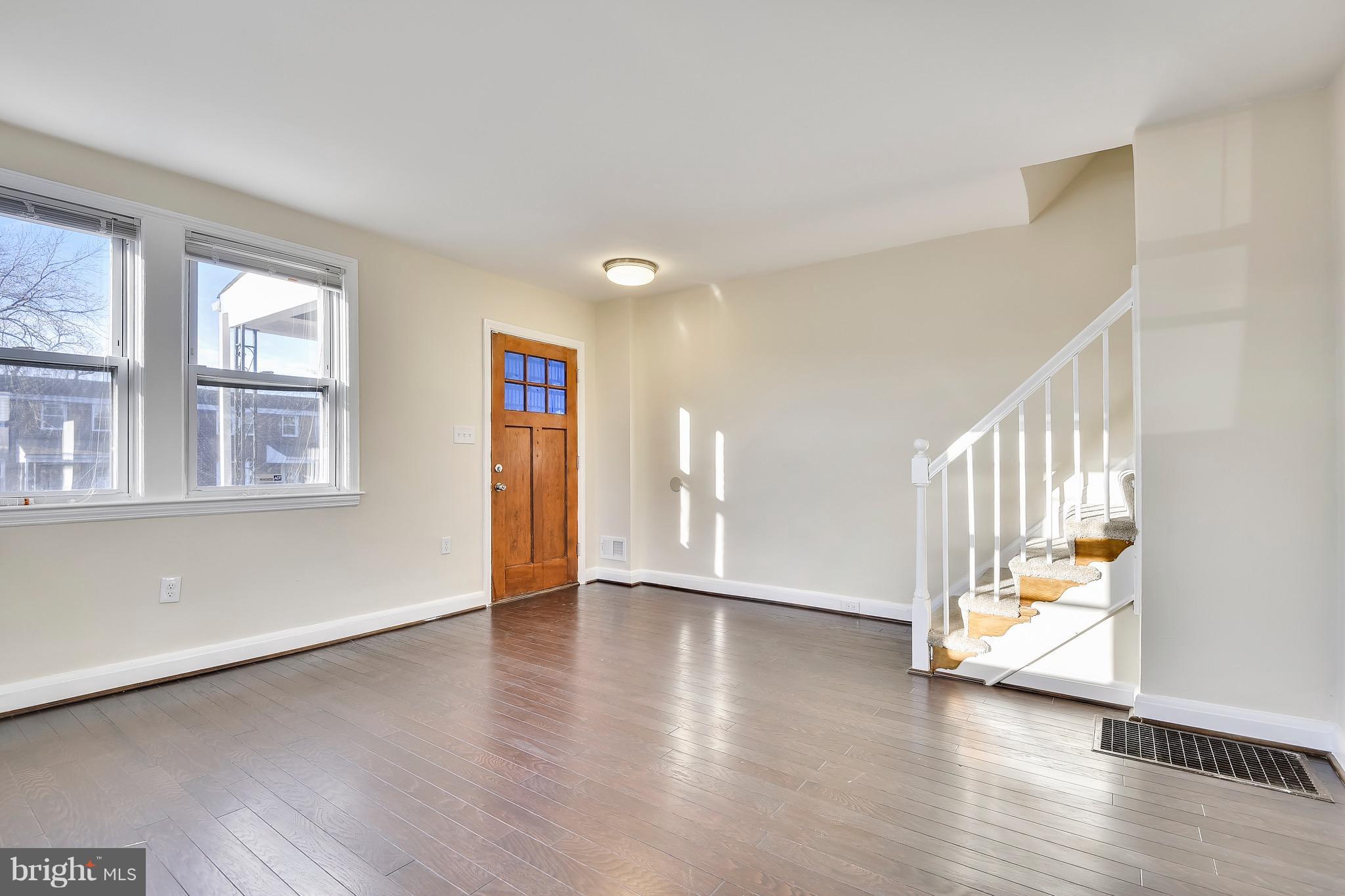 227 Old Riverside Road Baltimore, MD 21225 - Photo 7 of 20 a view of an entryway with wooden floor