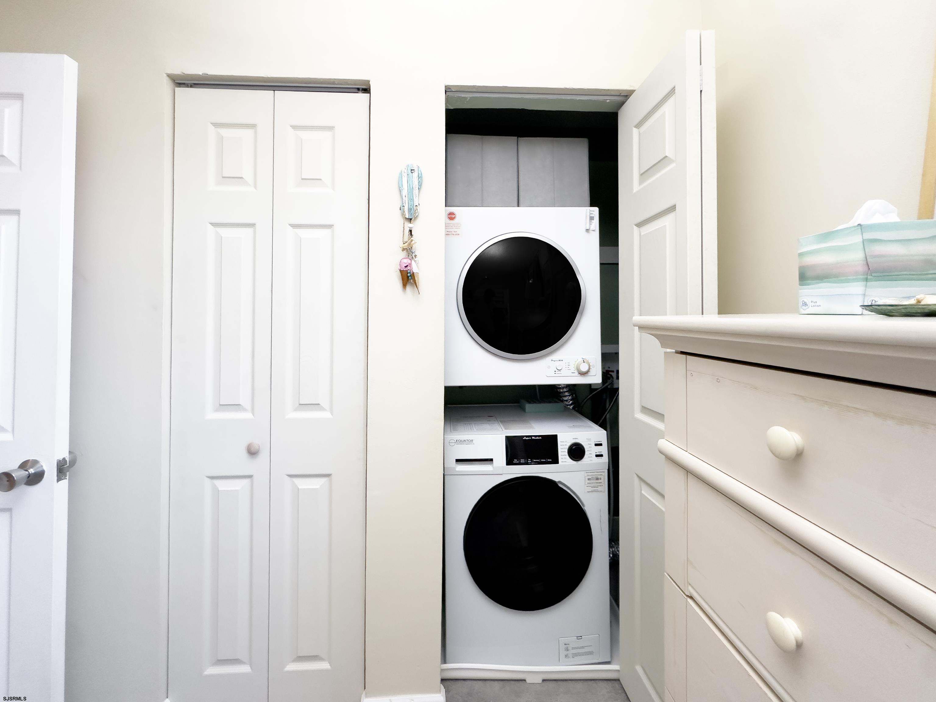 9801 Ventnor Avenue, Unit B1 Margate City, NJ 08402 - Photo 18 of 23 a view of washer and dryer in a utility room